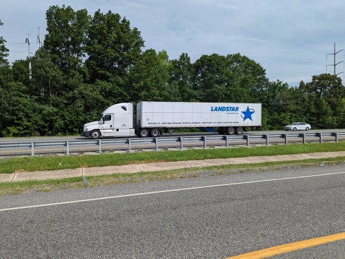 Tractor Trailer on highway that needs box truck insurance
